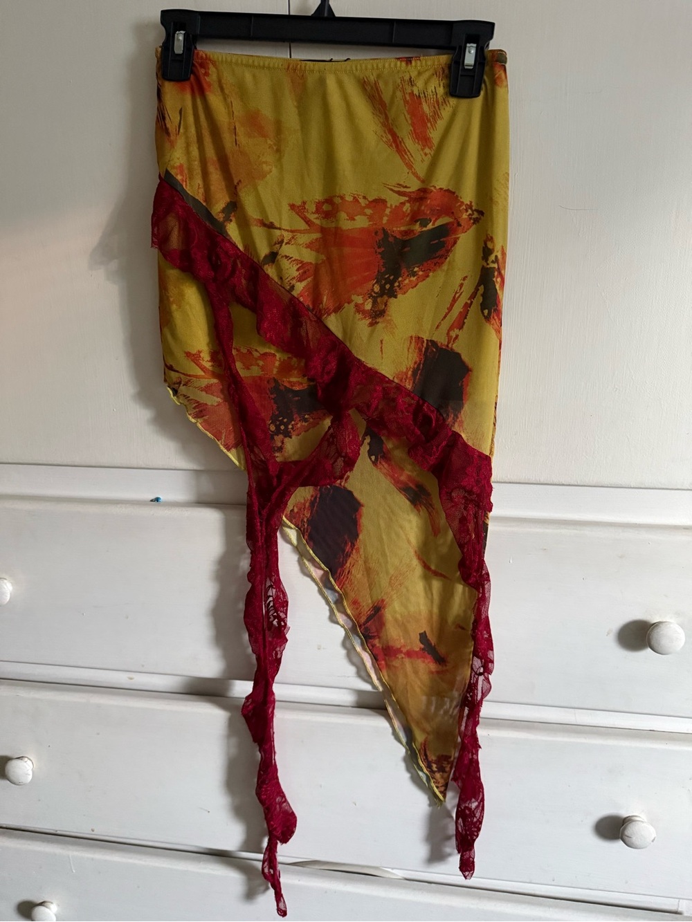 PrettyLittleThing Yellow Floral Asymmetric Skirt with Red Lace Detail